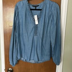 Woman’s blue long sleeve shirt. New with tags.